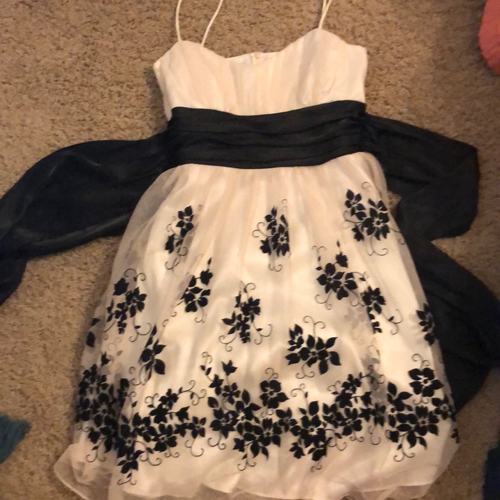 Pretty white dress with black flowers.